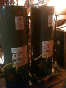 two hot water heaters beside each other