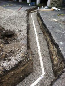 image of a pipe laying in a trench