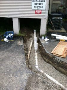 image of a pipe laying in a trench