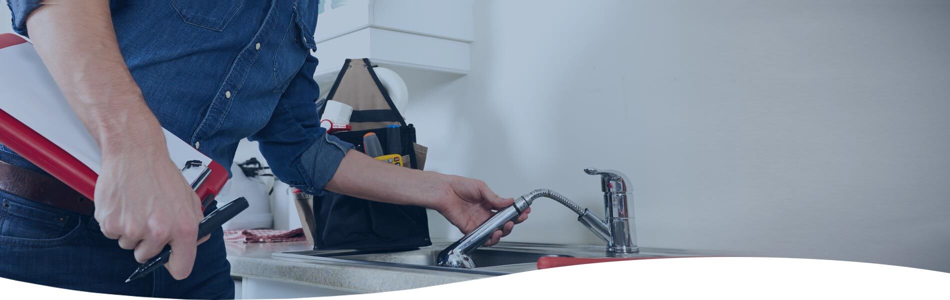 plumber checking a kitchen faucet