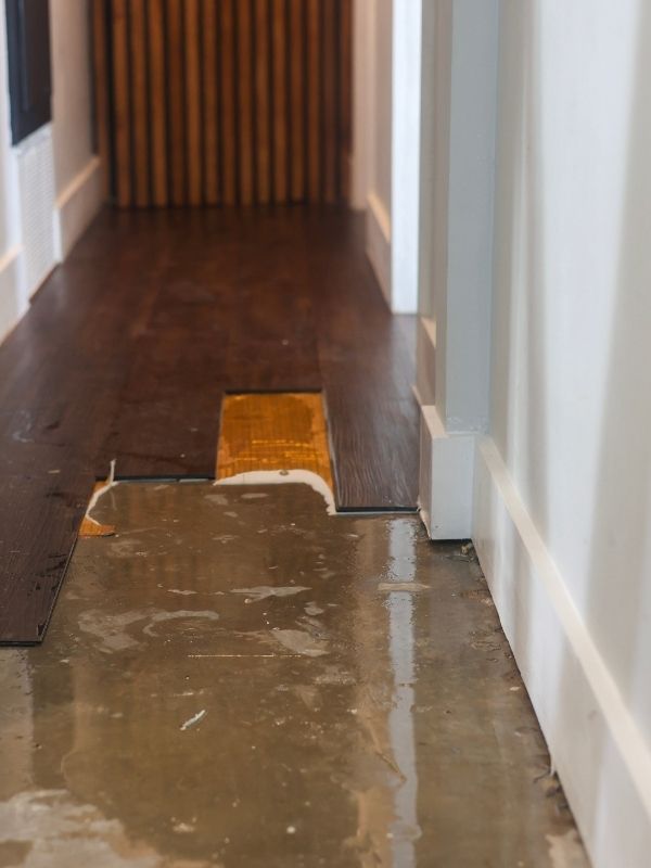 Damage from a slab leak in a residential house. 